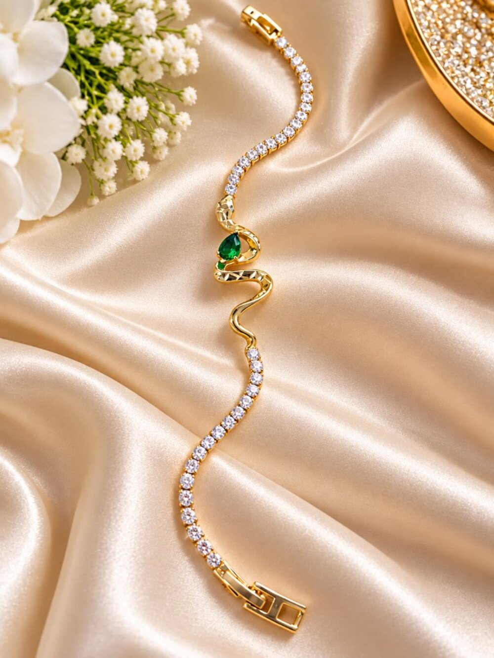 Elegant gold-tone bracelet featuring sparkling clear stones and a graceful wave-